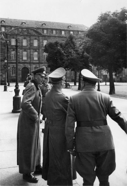 Adolf Hitler leaves the Strasbourg cathedral after his visit